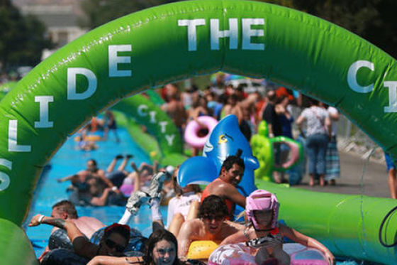 Customized Three Lanes Inflatable City Slide For Outdoor Sports Game